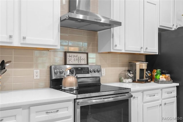 2056 W Learwood Pl, Beverly Hills, FL 34465 - kitchen featuring stainless steel electric range oven, wall chimney exhaust hood, backsplash, and white cabinets
