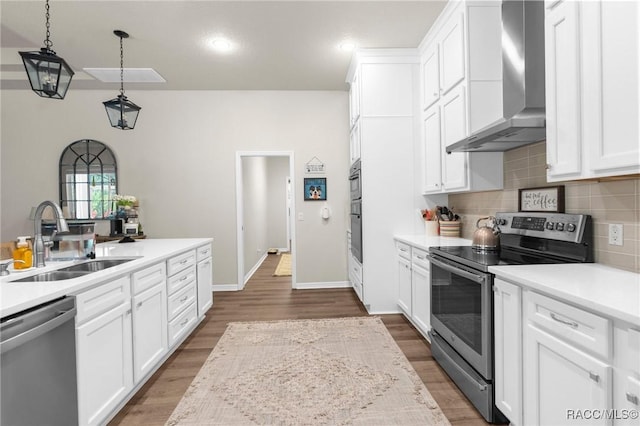 2056 W Learwood Pl, Beverly Hills, FL 34465 - kitchen with wall chimney range hood, appliances with stainless steel finishes, a sink, light countertops, and tasteful backsplash