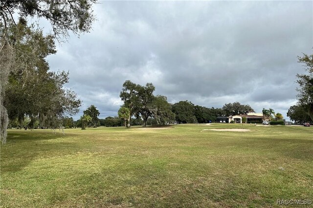 4450 E Windmill Dr Unit 106, 107, 206, 207, Inverness, FL 34453 - view of property's community with a yard