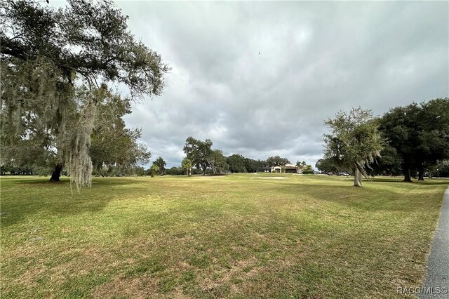 4450 E Windmill Dr Unit 106, 107, 206, 207, Inverness, FL 34453 - view of home's community with a yard