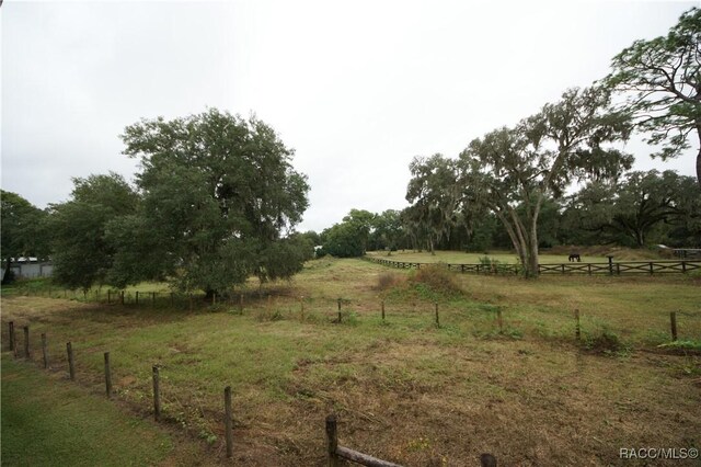 4450 E Windmill Dr Unit 106, 107, 206, 207, Inverness, FL 34453 - view of yard with fence and a view of countryside