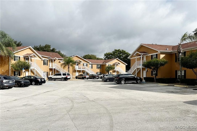 4450 E Windmill Dr Unit 106, 107, 206, 207, Inverness, FL 34453 - view of asphalt street featuring stairs and a residential view