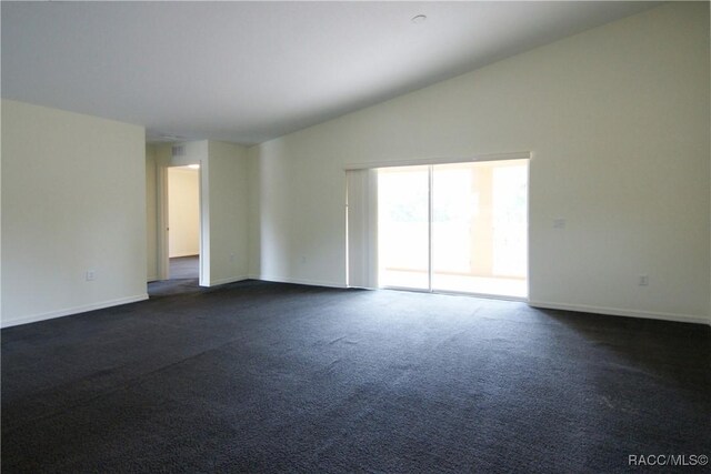 4450 E Windmill Dr Unit 106, 107, 206, 207, Inverness, FL 34453 - spare room with vaulted ceiling, baseboards, and dark carpet