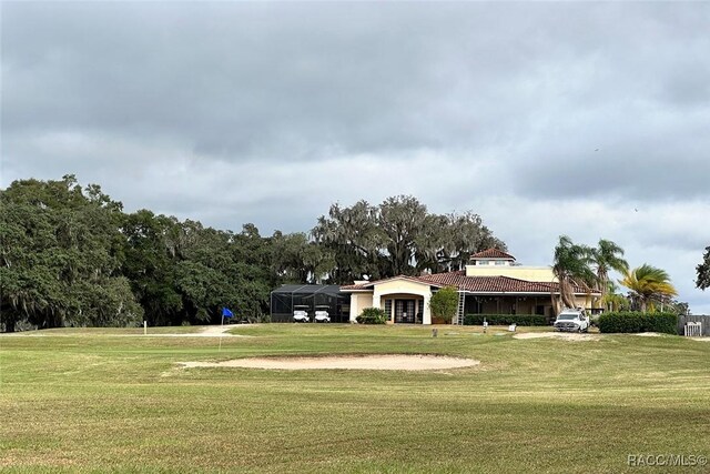 4450 E Windmill Dr Unit 106, 107, 206, 207, Inverness, FL 34453 - view of community featuring a yard and a carport