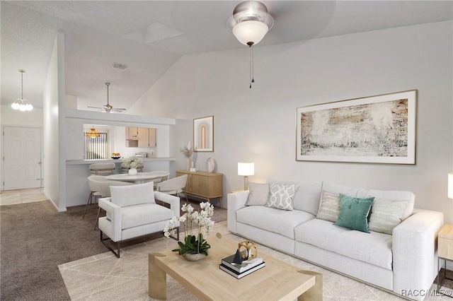 living room featuring ceiling fan, carpet, and high vaulted ceiling