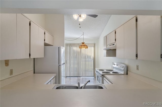 kitchen featuring pendant lighting, white cabinetry, white appliances, and sink