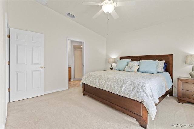 bedroom with light carpet, visible vents, baseboards, ceiling fan, and vaulted ceiling