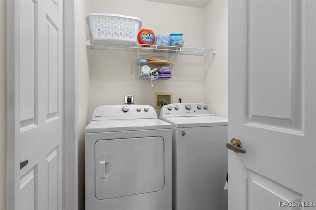 laundry area featuring laundry area and separate washer and dryer