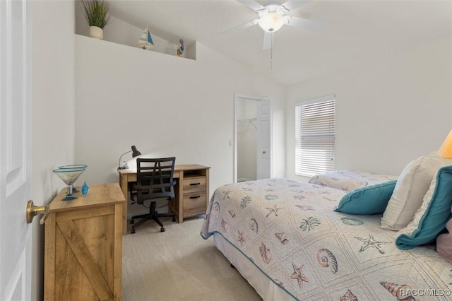 bedroom with a ceiling fan, light colored carpet, and vaulted ceiling