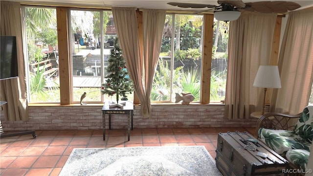 interior space featuring tile patterned flooring and ceiling fan