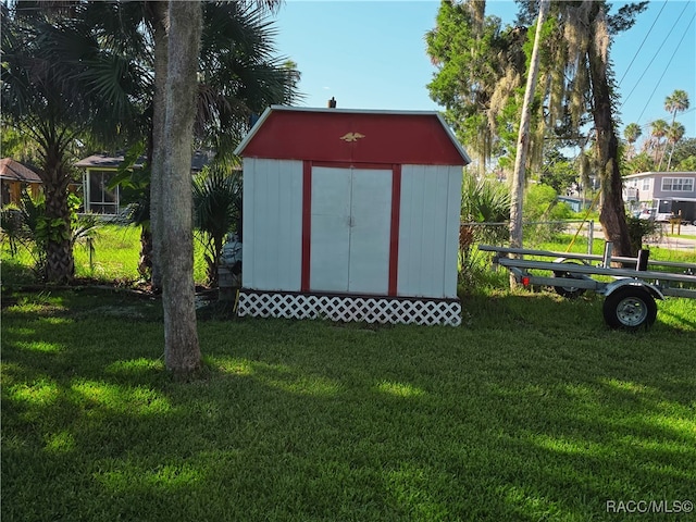 view of outdoor structure featuring a yard