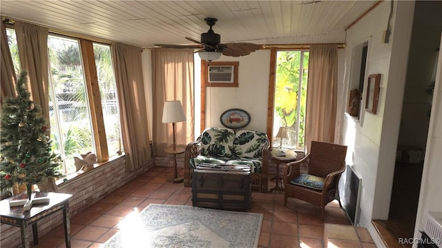 sunroom with ceiling fan, wooden ceiling, and a wall mounted AC