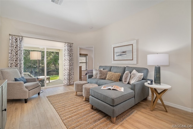 living room with light hardwood / wood-style floors