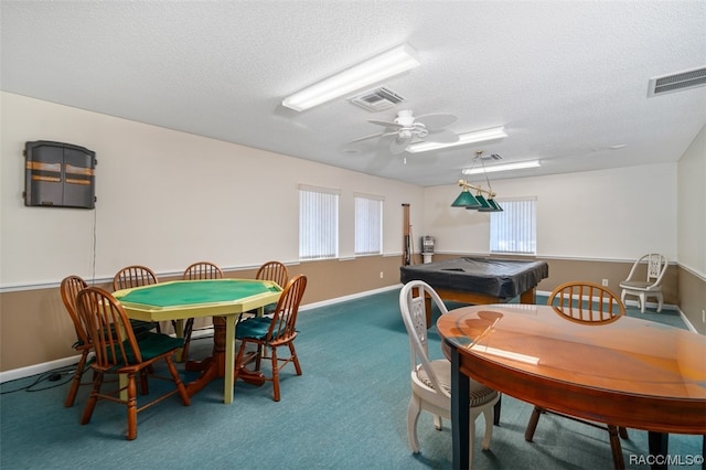 rec room featuring carpet, a textured ceiling, and a wealth of natural light