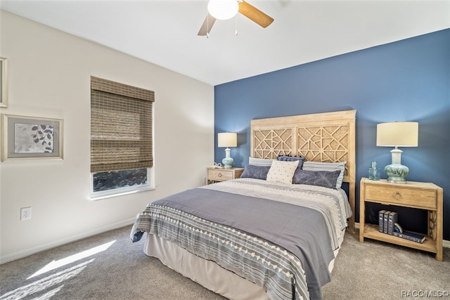 bedroom with light carpet and ceiling fan