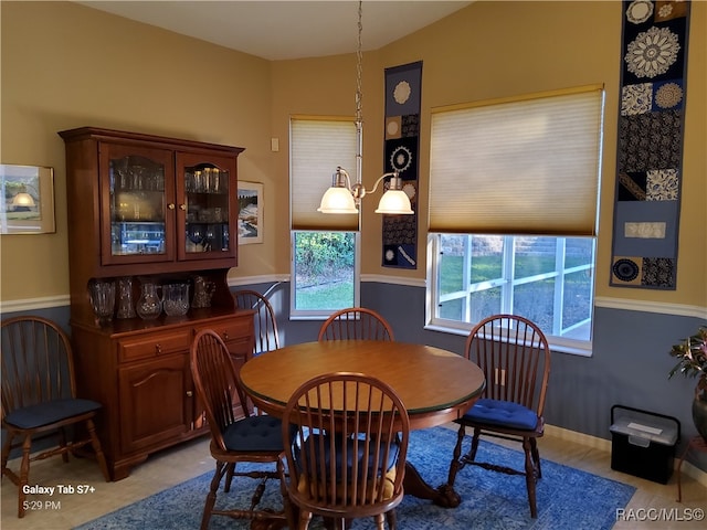 dining area featuring a chandelier