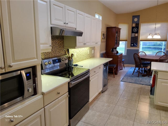 kitchen featuring an inviting chandelier, light tile patterned flooring, decorative light fixtures, white cabinets, and appliances with stainless steel finishes