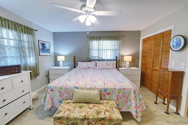 bedroom with ceiling fan and a closet