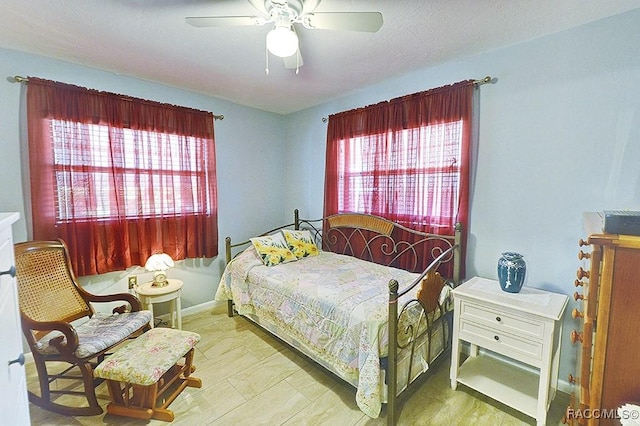 bedroom featuring light wood-type flooring and ceiling fan