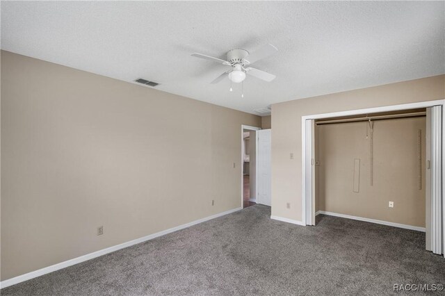 8831 E Sandpiper Dr, Inverness, FL 34450 - unfurnished bedroom with carpet, baseboards, a closet, and a ceiling fan