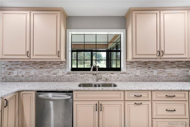 8831 E Sandpiper Dr, Inverness, FL 34450 - kitchen featuring dishwasher, cream cabinets, a sink, and backsplash