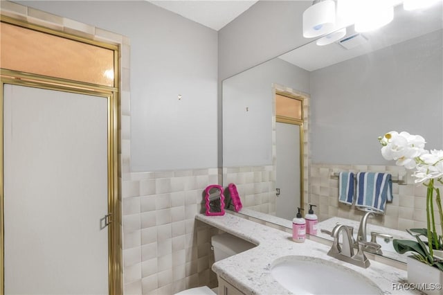 8831 E Sandpiper Dr, Inverness, FL 34450 - bathroom with tile walls, vanity, and toilet