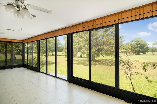 8831 E Sandpiper Dr, Inverness, FL 34450 - unfurnished sunroom featuring plenty of natural light and ceiling fan