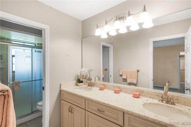 8831 E Sandpiper Dr, Inverness, FL 34450 - full bathroom with double vanity, a shower stall, toilet, and tile patterned flooring