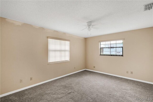 8831 E Sandpiper Dr, Inverness, FL 34450 - carpeted empty room with ceiling fan, baseboards, and a textured ceiling