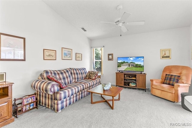 living room with carpet, vaulted ceiling, and ceiling fan