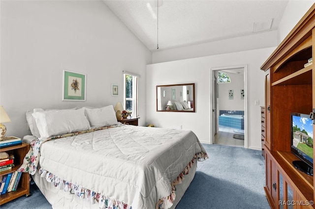 bedroom featuring high vaulted ceiling, carpet floors, and ensuite bathroom