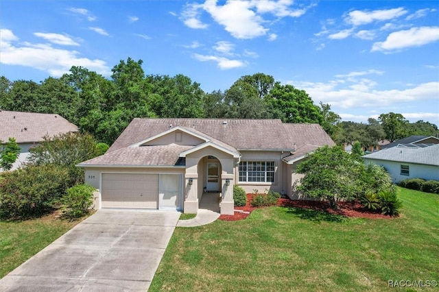 ranch-style house with a garage and a front lawn