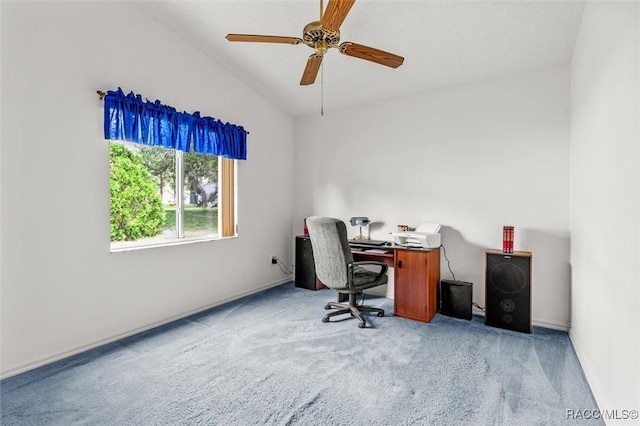 carpeted office featuring lofted ceiling and ceiling fan