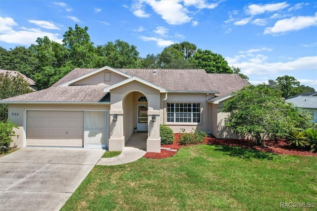 ranch-style home with a front yard and a garage