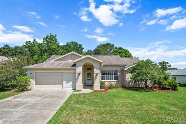 ranch-style house featuring a garage and a front yard