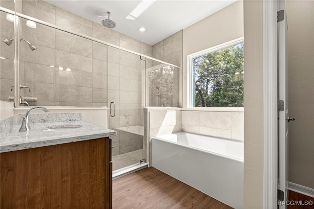 5235 N Sonora Ter, Beverly Hills, FL 34465 - full bathroom with a bath, a stall shower, wood finished floors, and vanity