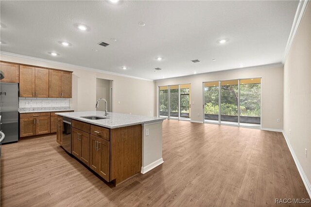 5235 N Sonora Ter, Beverly Hills, FL 34465 - kitchen featuring stainless steel appliances, crown molding, open floor plan, decorative backsplash, and a center island with sink