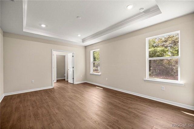 5235 N Sonora Ter, Beverly Hills, FL 34465 - empty room with a raised ceiling, ornamental molding, dark wood-type flooring, and recessed lighting