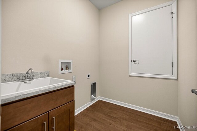 5235 N Sonora Ter, Beverly Hills, FL 34465 - laundry area with hookup for an electric dryer, washer hookup, dark wood-type flooring, and cabinet space