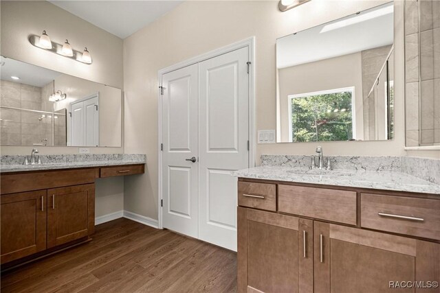5235 N Sonora Ter, Beverly Hills, FL 34465 - full bathroom with wood finished floors, a stall shower, and two vanities