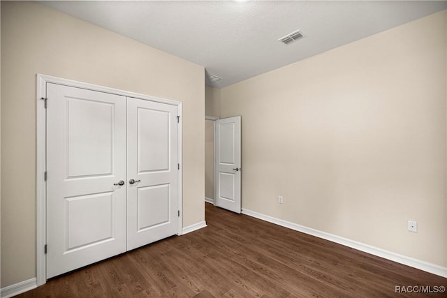 5235 N Sonora Ter, Beverly Hills, FL 34465 - unfurnished bedroom with dark wood-style flooring and a closet