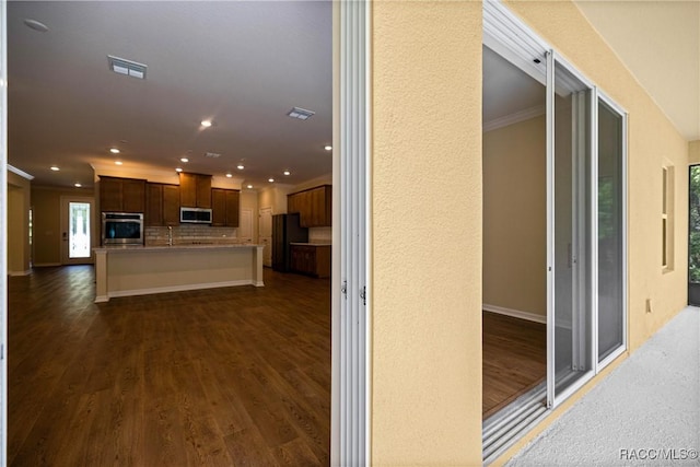 5235 N Sonora Ter, Beverly Hills, FL 34465 - hallway with crown molding, recessed lighting, and dark wood finished floors