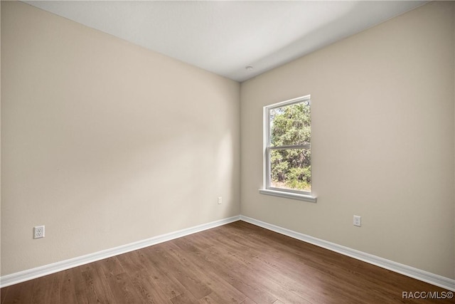 5235 N Sonora Ter, Beverly Hills, FL 34465 - unfurnished room featuring baseboards and dark wood-style flooring