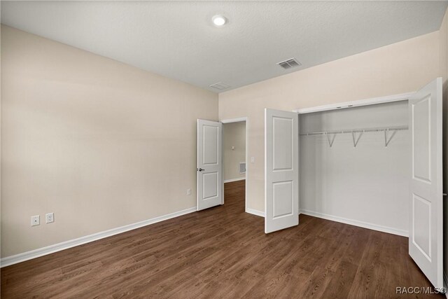 5235 N Sonora Ter, Beverly Hills, FL 34465 - unfurnished bedroom featuring dark wood finished floors and a closet