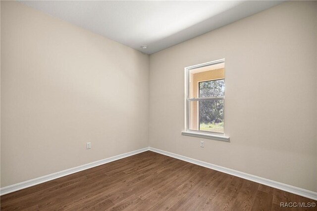 5235 N Sonora Ter, Beverly Hills, FL 34465 - empty room featuring baseboards and dark wood-style flooring