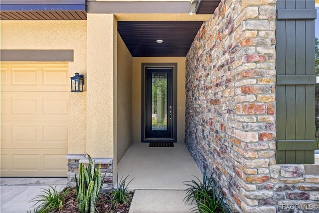 5235 N Sonora Ter, Beverly Hills, FL 34465 - entrance to property featuring stucco siding and stone siding