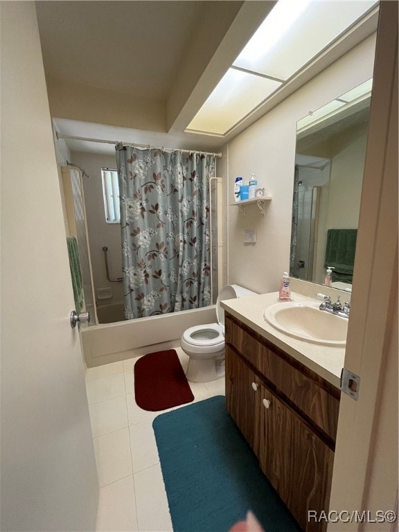 full bathroom featuring tile patterned flooring, shower / bath combo, vanity, and toilet