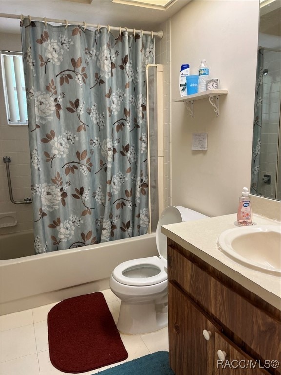 full bathroom featuring toilet, shower / bath combo, vanity, and tile patterned floors