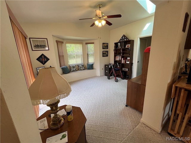 interior space with ceiling fan and light carpet