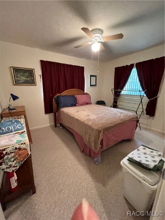 bedroom with carpet flooring and ceiling fan